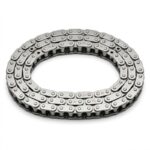 Close-up view of timing chain with gears inside car engine for mechanical synchronization